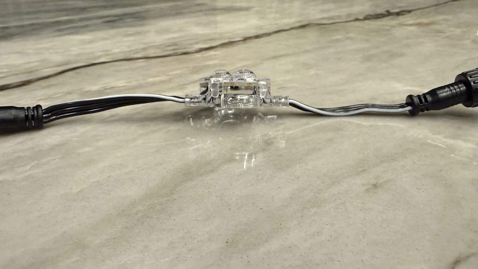 Side profile of a Bosso permanent-lighting node with three raised clear lenses