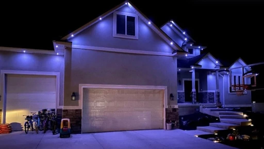 Permanent lighting on a residential roofline set to white