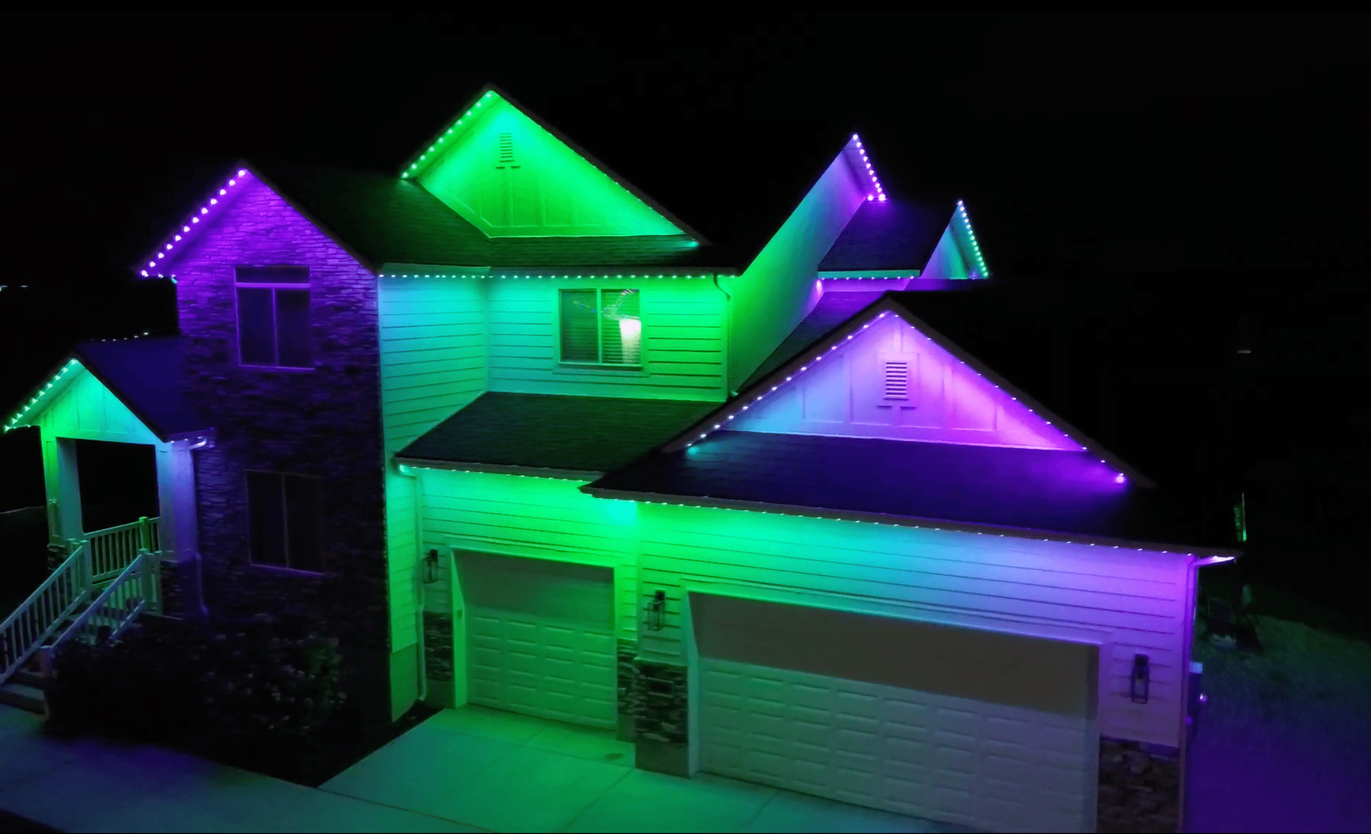 Permanent holiday lighting displaying orange and purple for Halloween on a Salt Lake City home