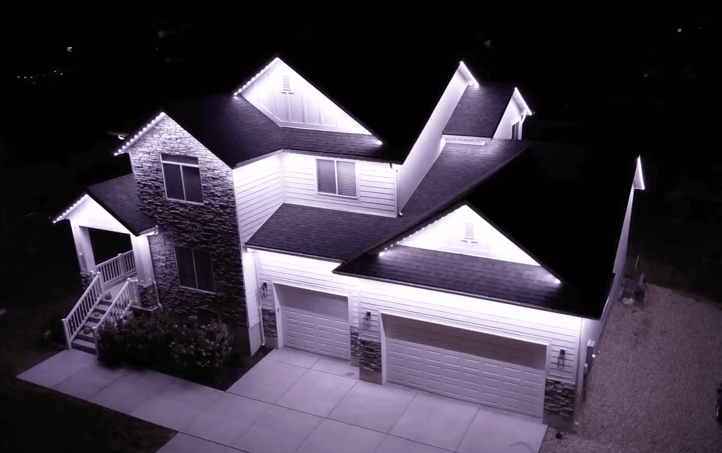 Permanent LED roofline lighting in pure white on a Salt Lake City home